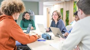 People at a table to suggest Lancaster University Management School